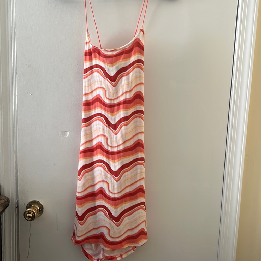 Multi-color dress. Medium. Never worn. Crisscross back.